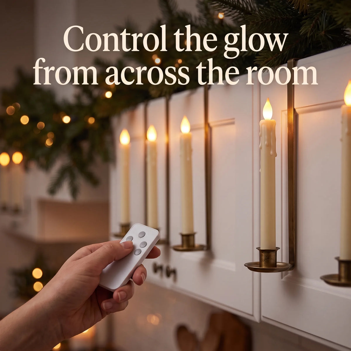 Hand using the remote to control cabinet candles from across the room