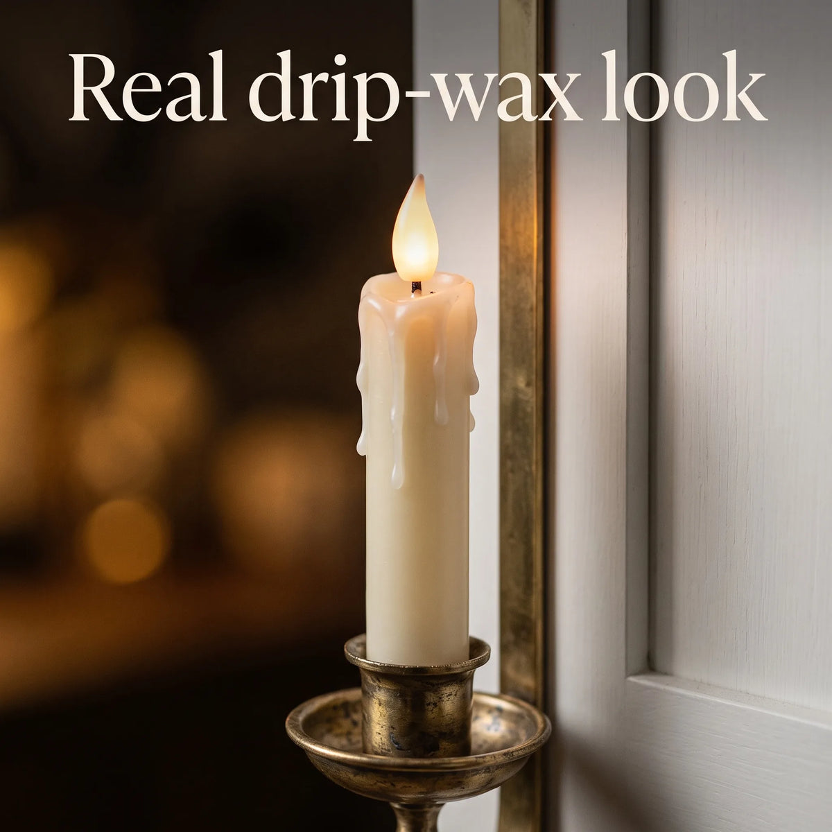 Close-up of the drip-wax taper and LED flame in an antique brass holder